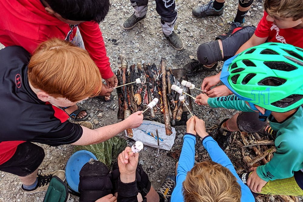 Toasting marshmallows around the campfire