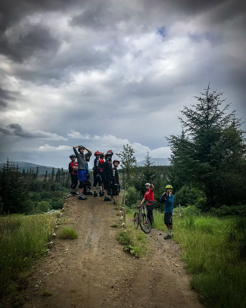 The kids checking out the archway jump at the end of the motorway section of the DH World Cup track