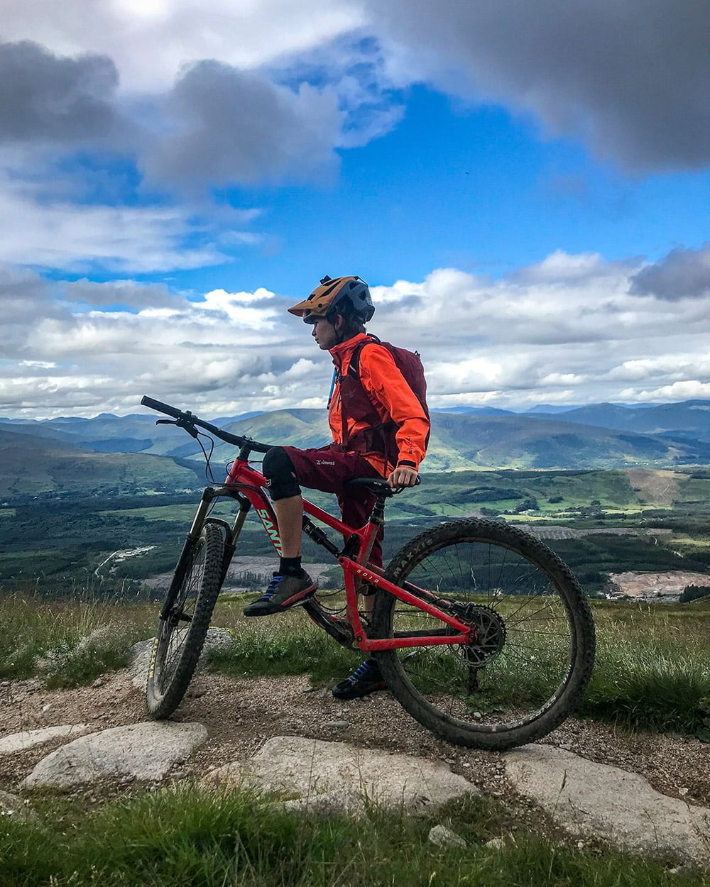Thomas pensively looking down the trail with Glen Nevis in the background